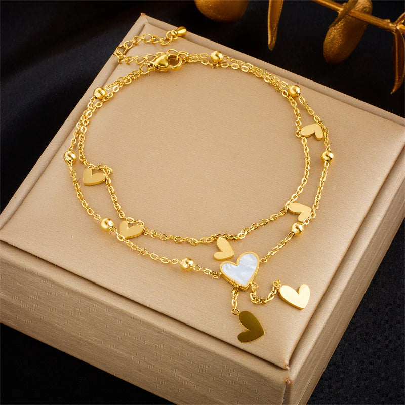 Tobillera ,acero de titanio Corazones Nácar blanco