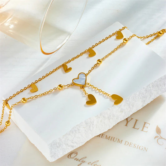 Tobillera ,acero de titanio Corazones Nácar blanco